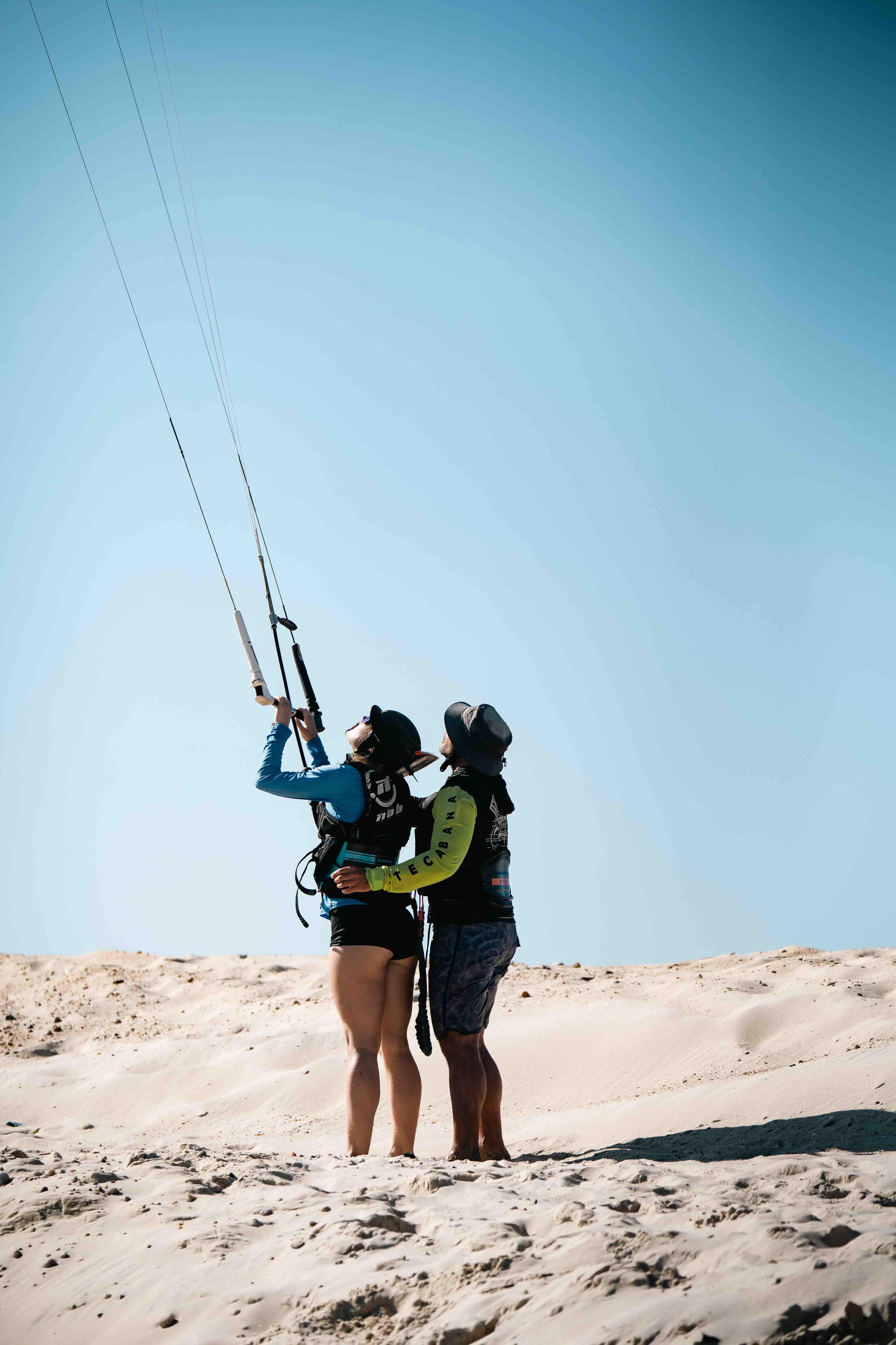 Two women practicing kite skills